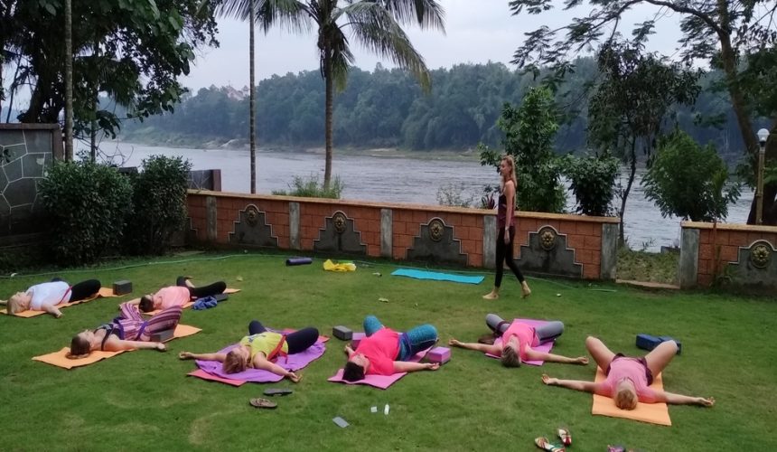 performing Yoga retreat in Kerala